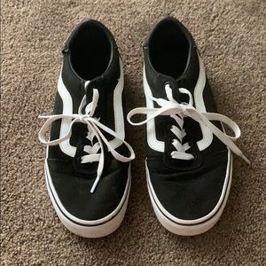 Pair of black Vans.